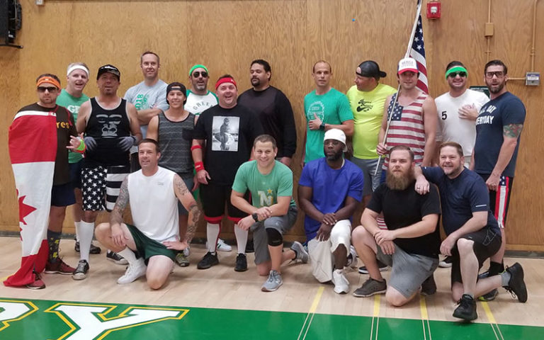 GDC members pose together in a school gym